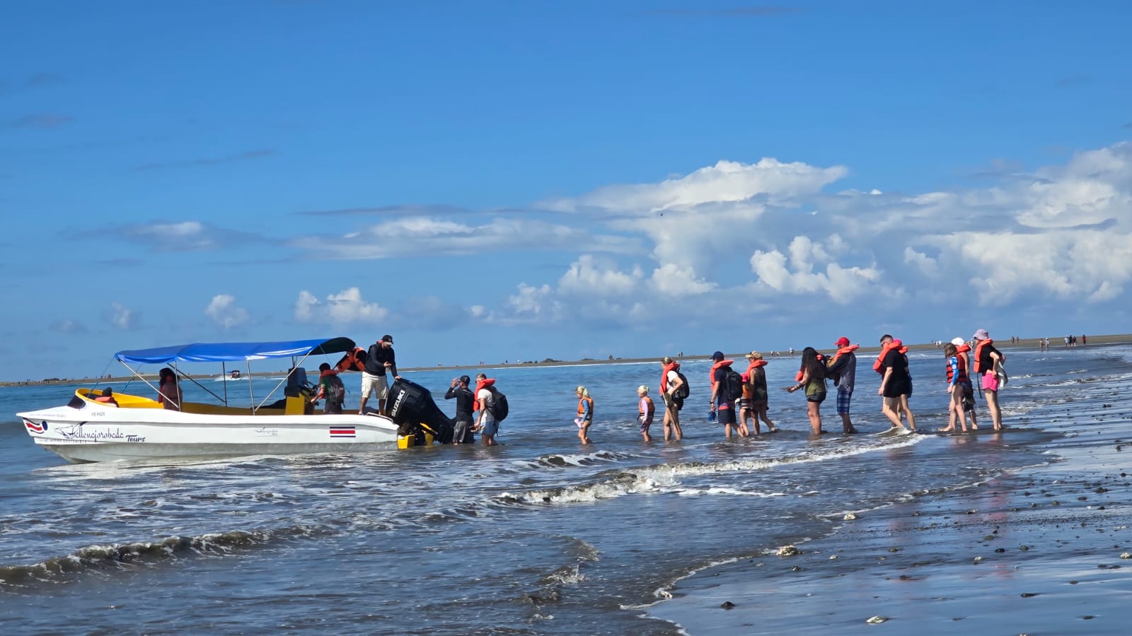 Visitors and our boat at the beach